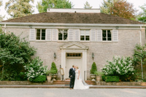 a couple standing in front of bridgerton wedding venue in seattle