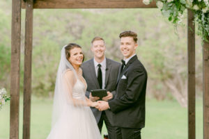 Couple exchanging vows at wedding.
