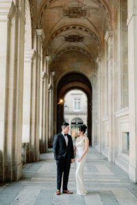a bride and groom in a tunnel near the louvre for their paris elopement