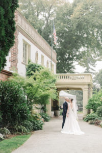 lairmont manor wedding photo of bride and groom standing outside the wedding venue