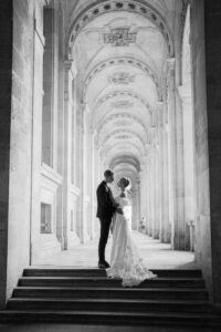 black and white image of a bride and groom facing each other and embracing in paris