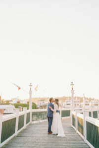 a bride and groom kissing at roche harbor