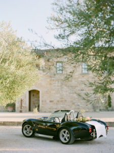 a fancy black car in front of sunstone winery