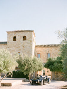 a fancy black car in front of sunstone winery