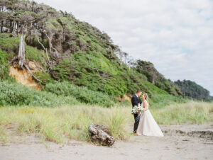 a bride and groom on a beach at seabrook for their wedding