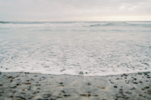 a rocky beach during sunset