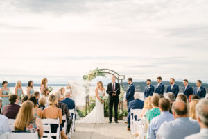 a bride and groom standing at the wedding alter at chambers bay wedding venue in tacoma