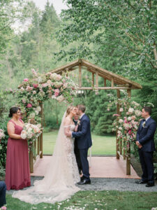 a bride and groom kissing at the alter at their wedding at jardin del sol
