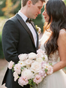 a bride and groom with their foreheads together looking at each other at their garden wedding venue in sonoma