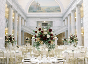 a large floral centerpiece at a wedding at the utah state capital