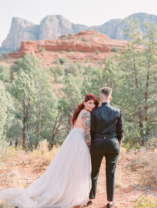 two brides standing in sedona for their elopement 