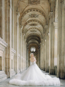 a bride standing in a tunnel near the louvre for her elegant paris elopement