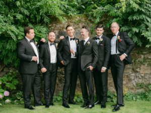 groom and groomsmen in black tuxes at a scotland micro wedding