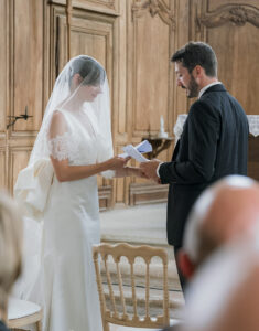 a bride and groom at the alter at their church wedding in champagne