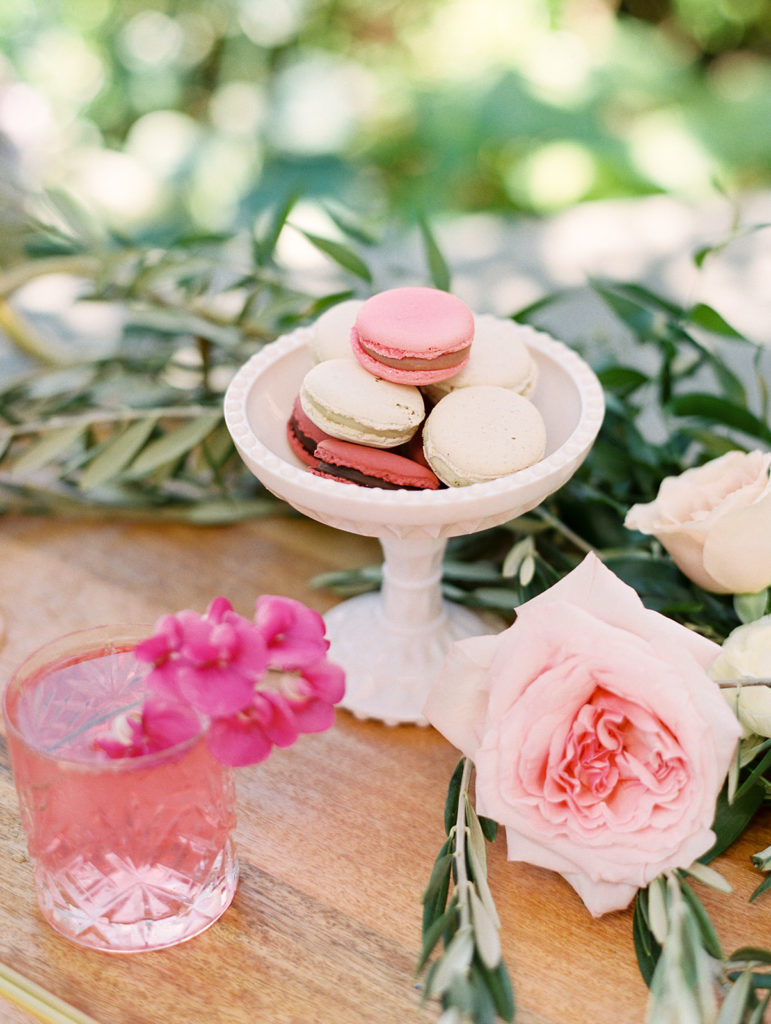 macroons and cocktails on bar cart