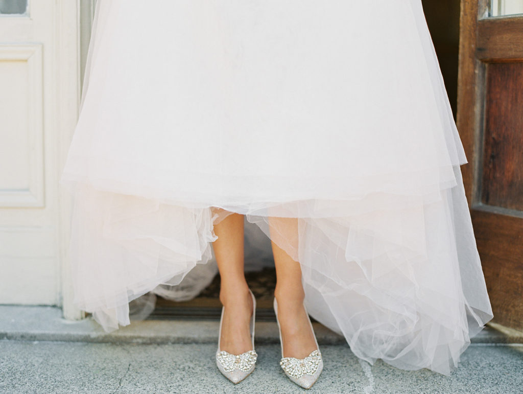 bride in pink wedding dress with sparkly shoes