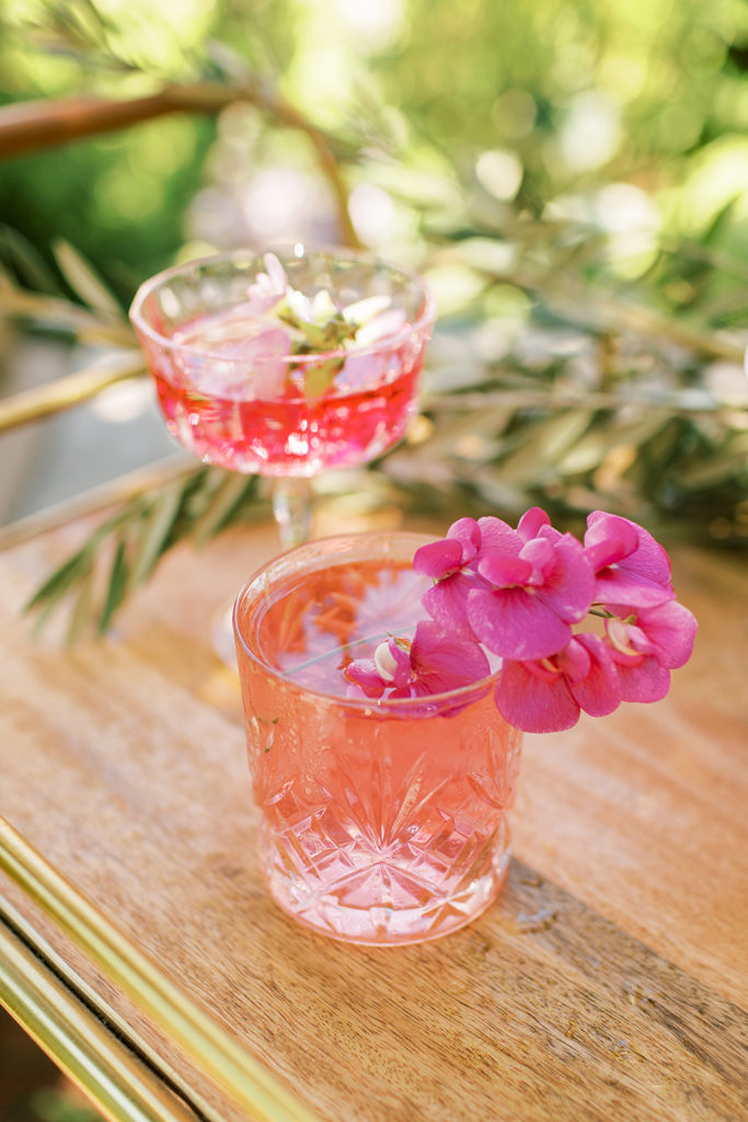 pink cocktails with flowers on top