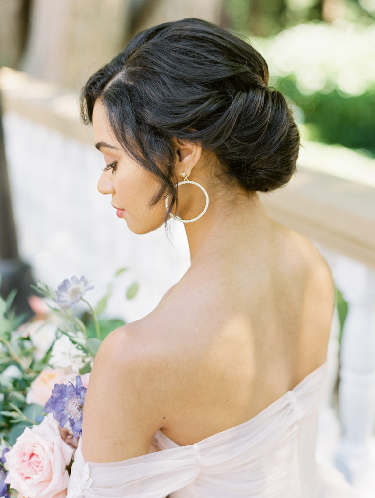 bride looking down with a classy elegant updo