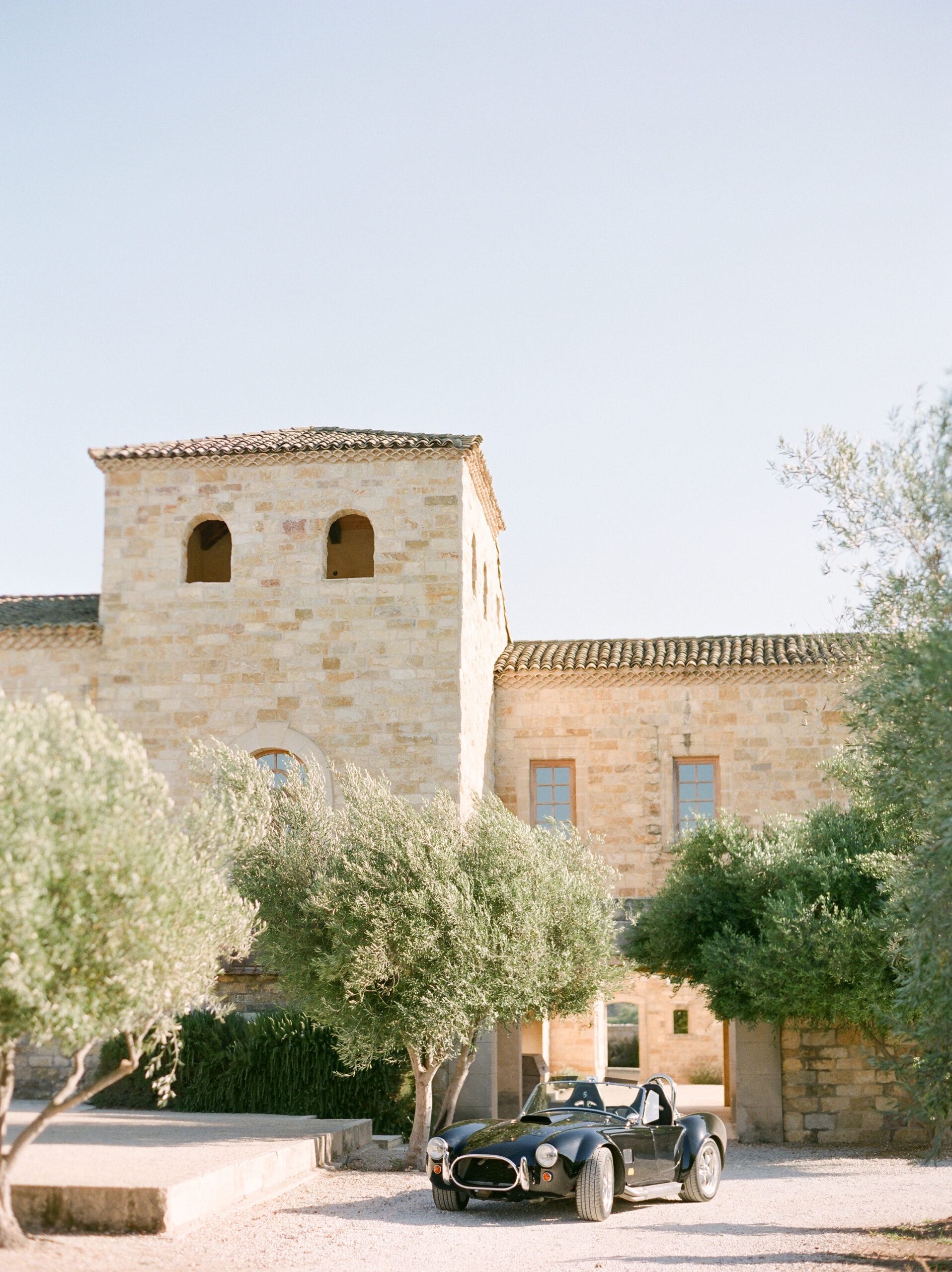 a fancy black car in front of sunstone winery for a wedding send off ideas