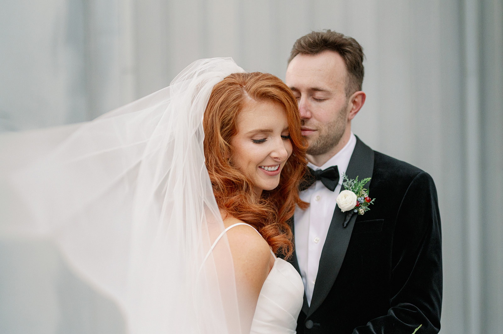 a bride and groom at the edgewater hotel in seattle for their winter wedding in december
