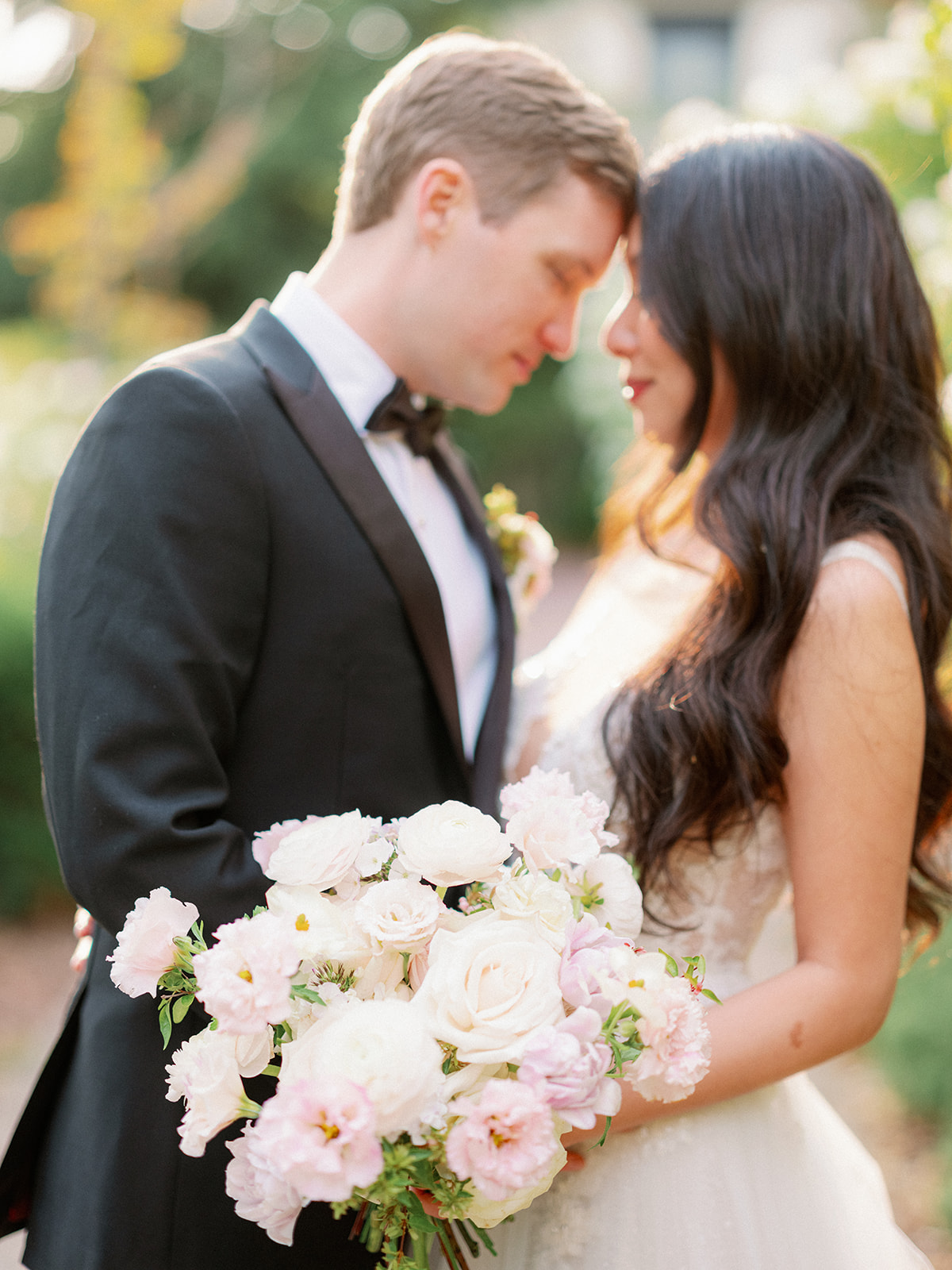 a bride and groom with their foreheads together looking at each other at their garden wedding venue in sonoma