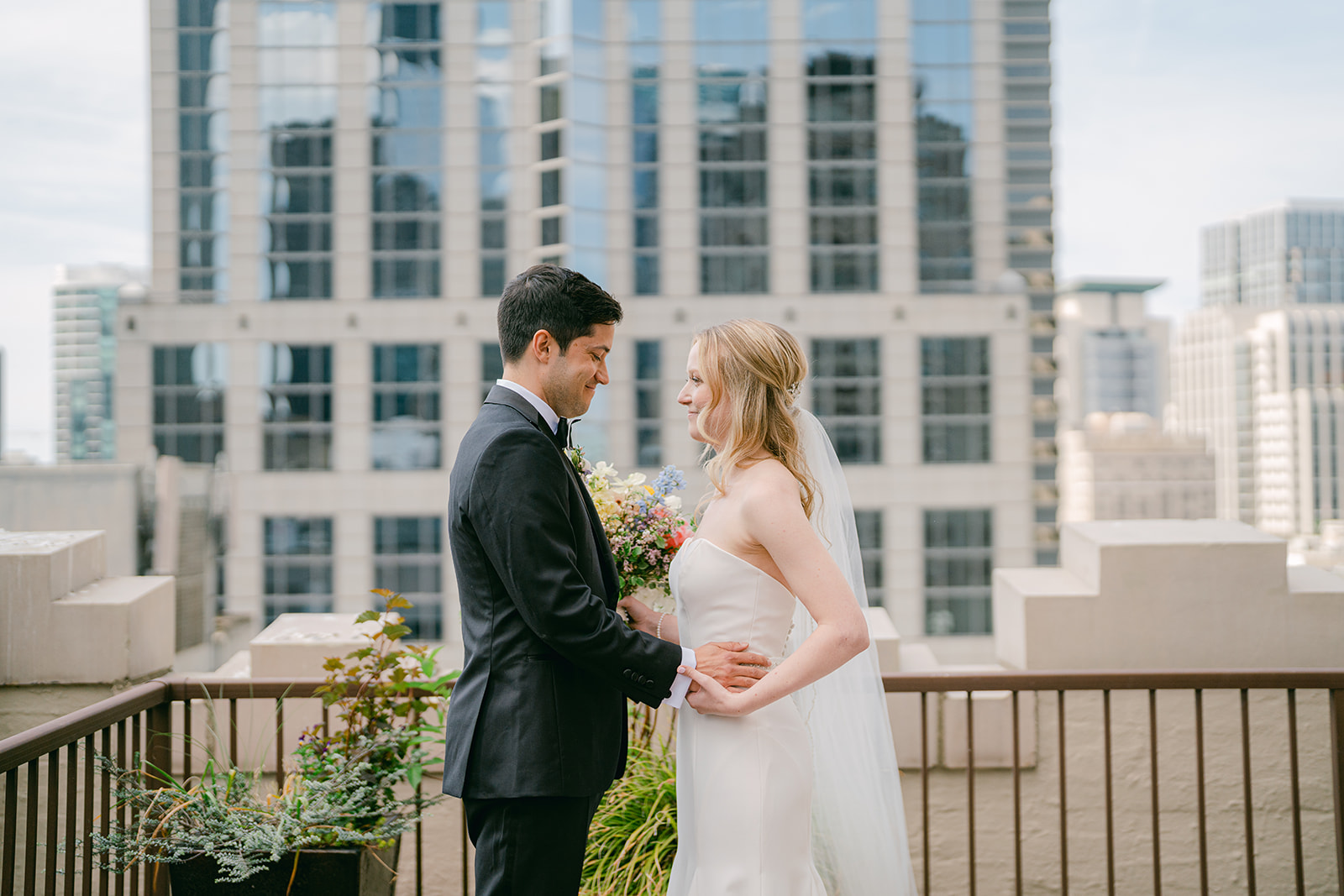 a bride and groom facing each other at their downtown seattle wedding venue